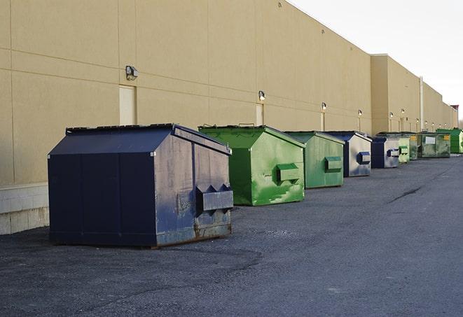 heavy-duty roll-off dumpsters outside a construction zone in Canton